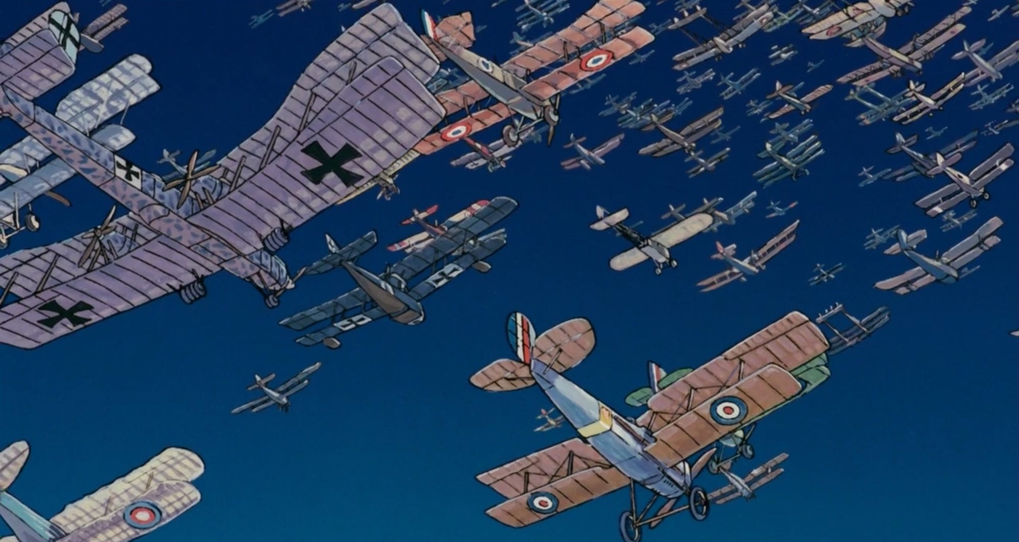 A huge amount of biplanes in a clear blue sky
