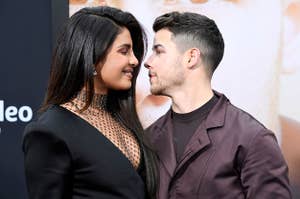 Priyanka Chopra and Nick Jonas at a red carpet, gazing lovingly into each other's eyes