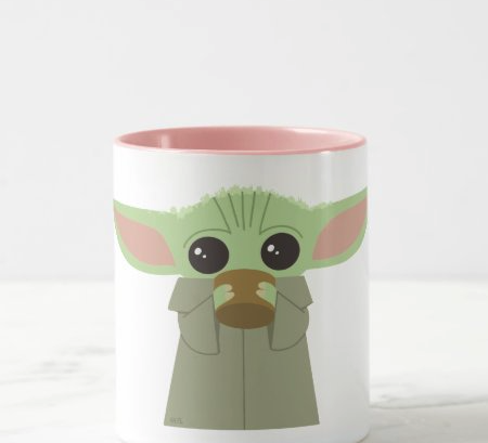 baby yoda sipping out of a cup on a mug 