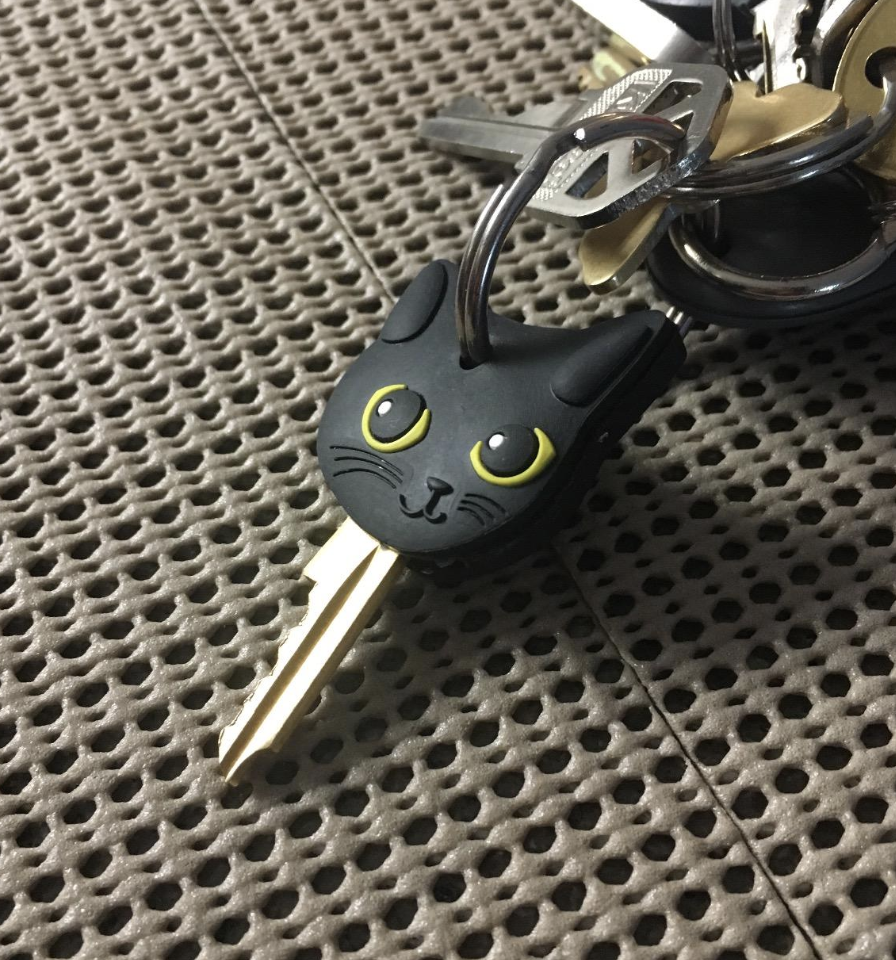 A black silicone cat on a keychain 