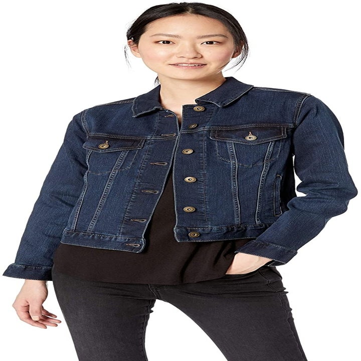 model wearing dark blue denim jacket