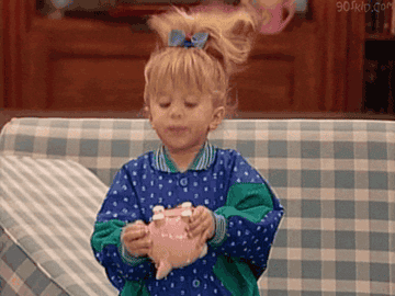 Gif of a child shaking a piggy bank