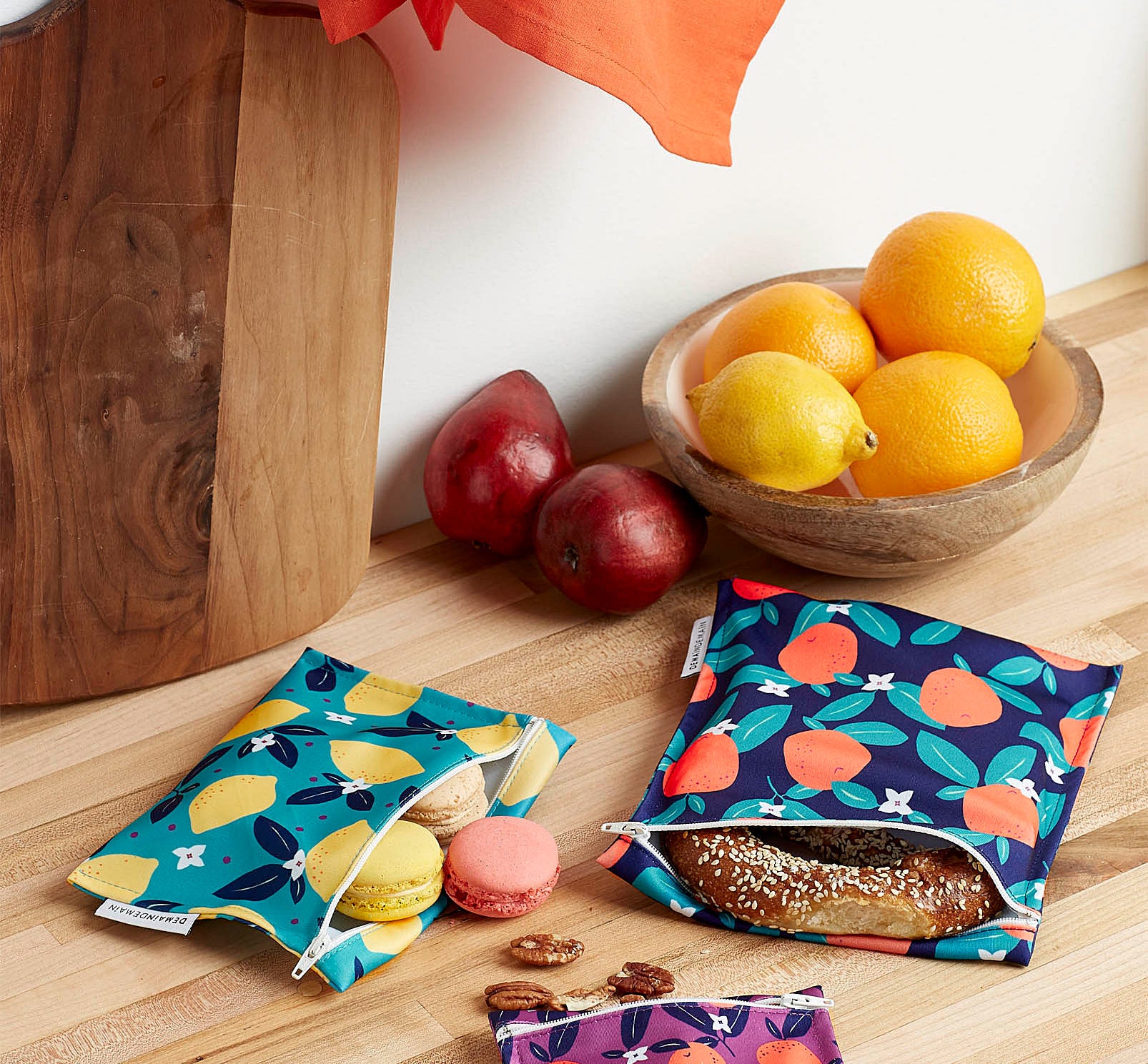Three fabric food bags of different colours and sizes