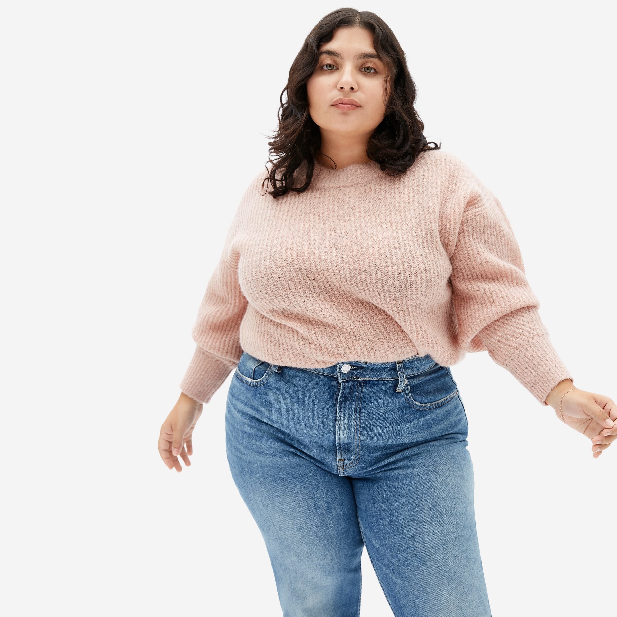 a model in a blush pink sweater