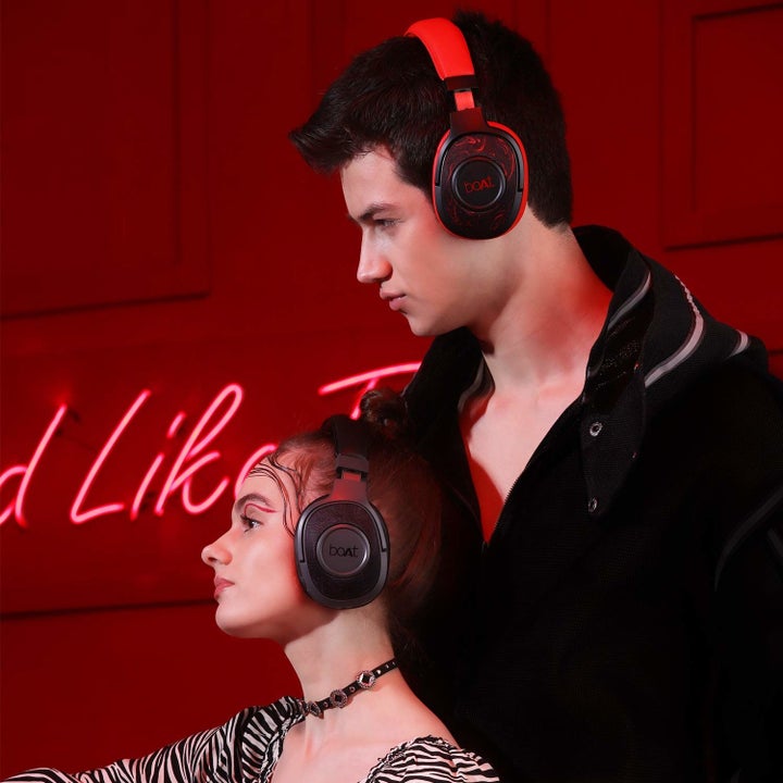 Two people with the headphones on.