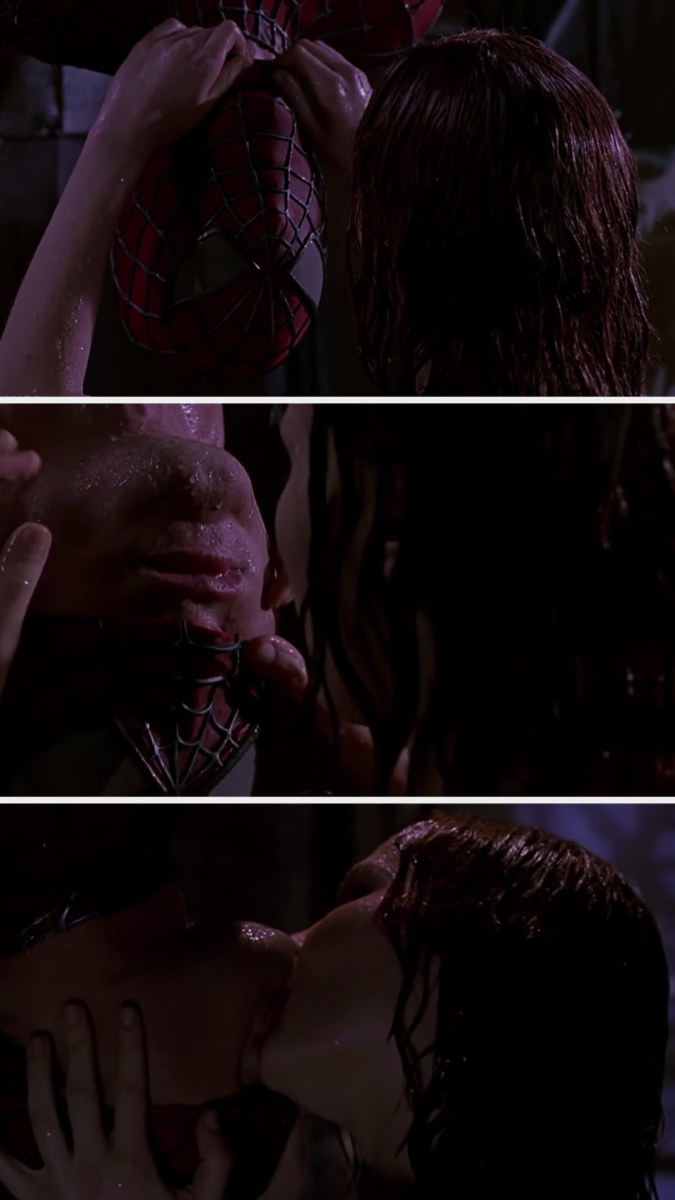 Mary Jane taking off Spiderman&#x27;s mask just so that his mouth is uncovered so she can kiss him as he hangs upside down in the rain