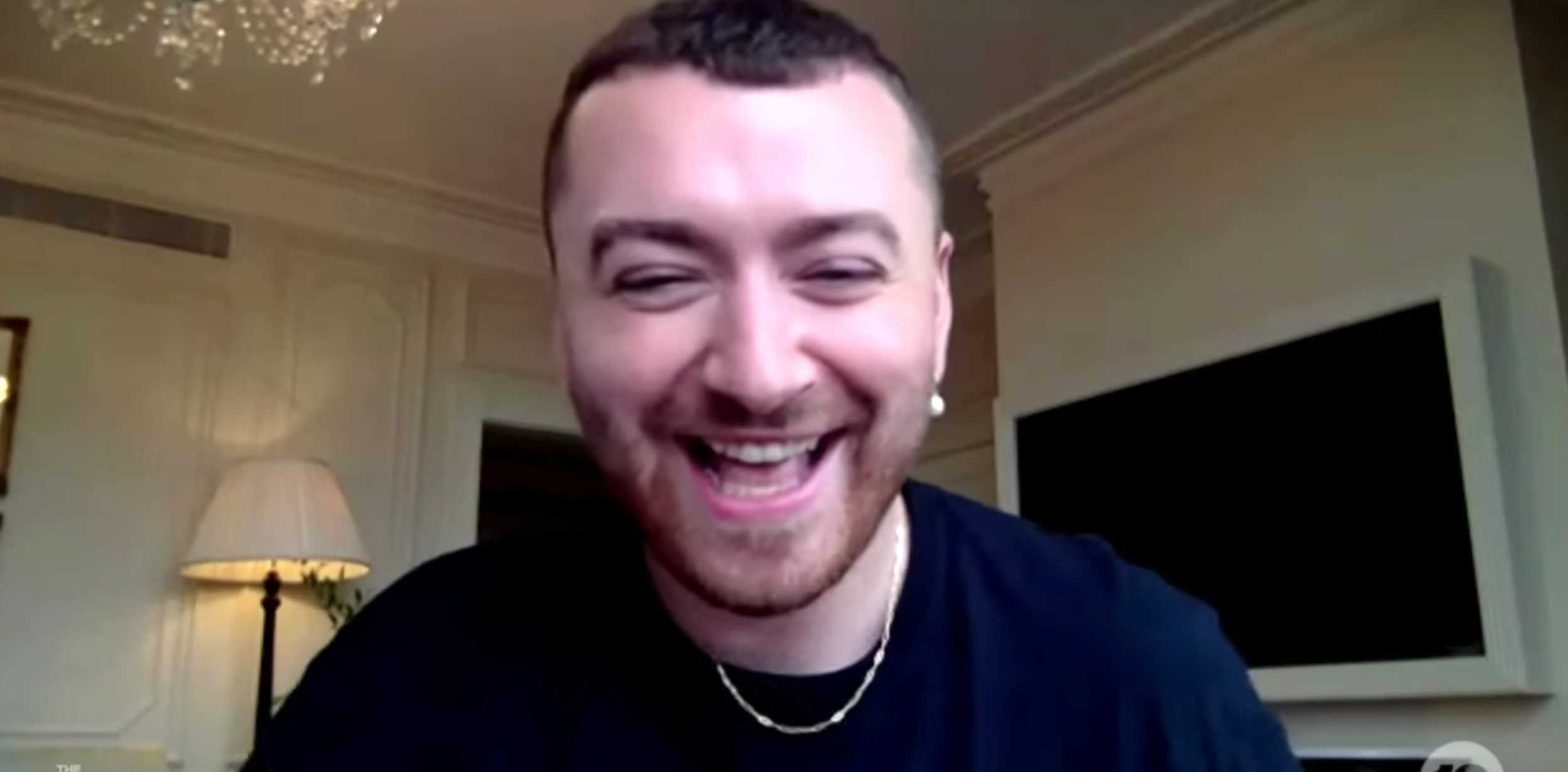 Sam Smith laughing as they recount the story of the mug
