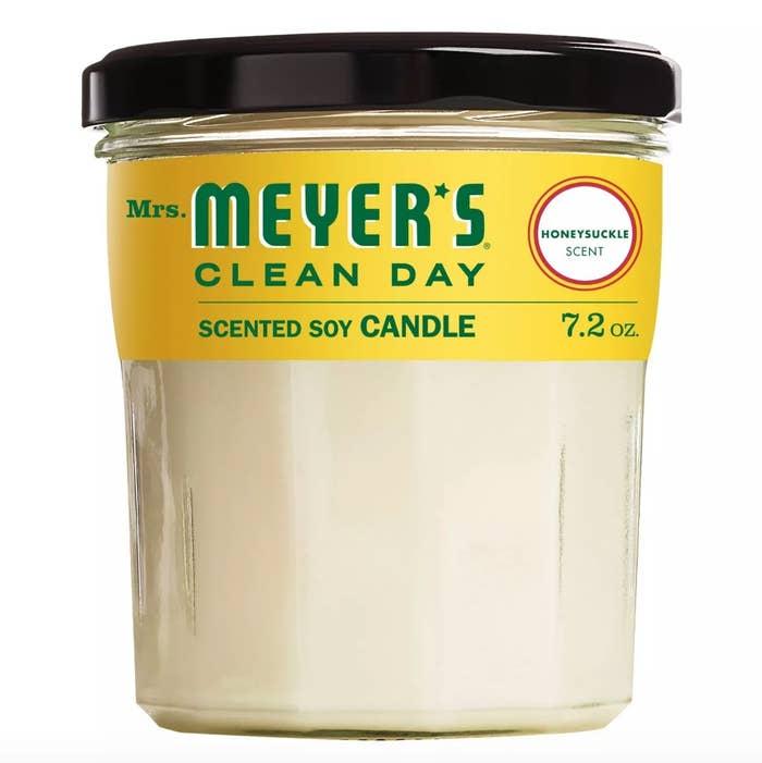 The Mrs. Meyer&#x27;s candle in honeysuckle with a yellow label