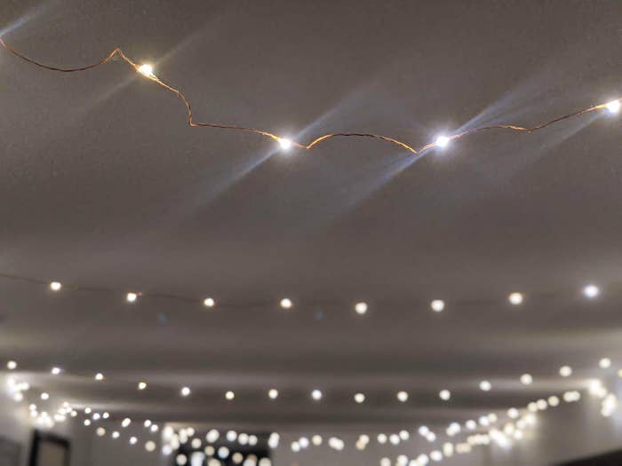 A close up of the firefly lights strung up on a ceiling