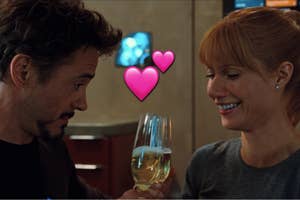 Iron Man and Pepper Potts drinking champagne together