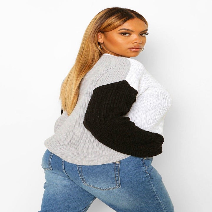 A shot of the back of the sweater showing that it is gray 