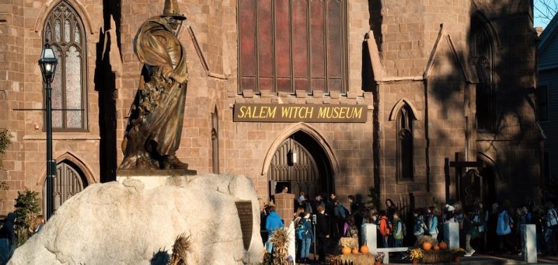 exterior shot of a building with sign reading &quot;Salem witch museum&quot;