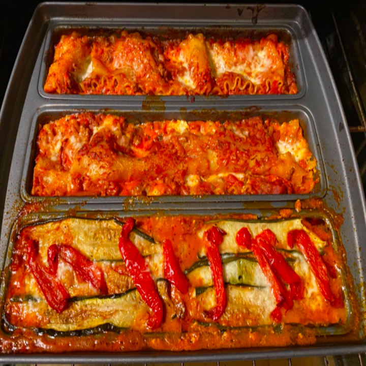 A reviewer photo of three different types of lasagna made in the pan