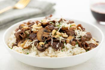 Steak and wild mushroom risotto in a bowl