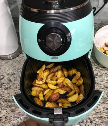 A reviewer photo of potato wedges they made in the air fryer