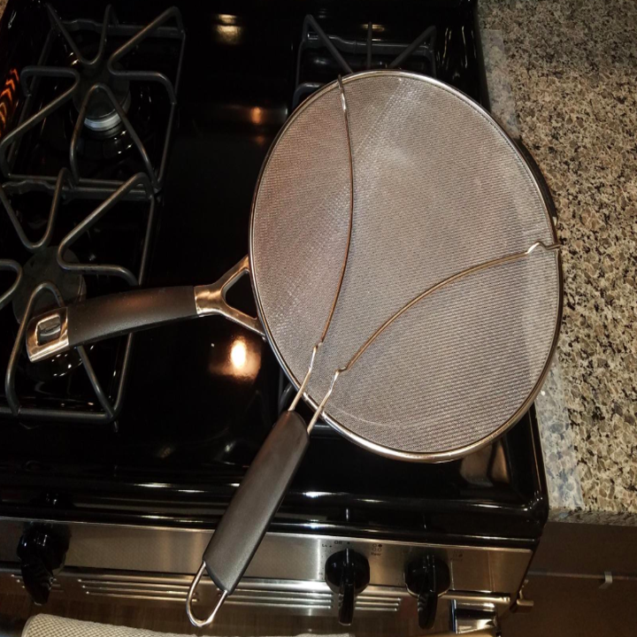 A reviewer photo of the splatter screen on top of a pan