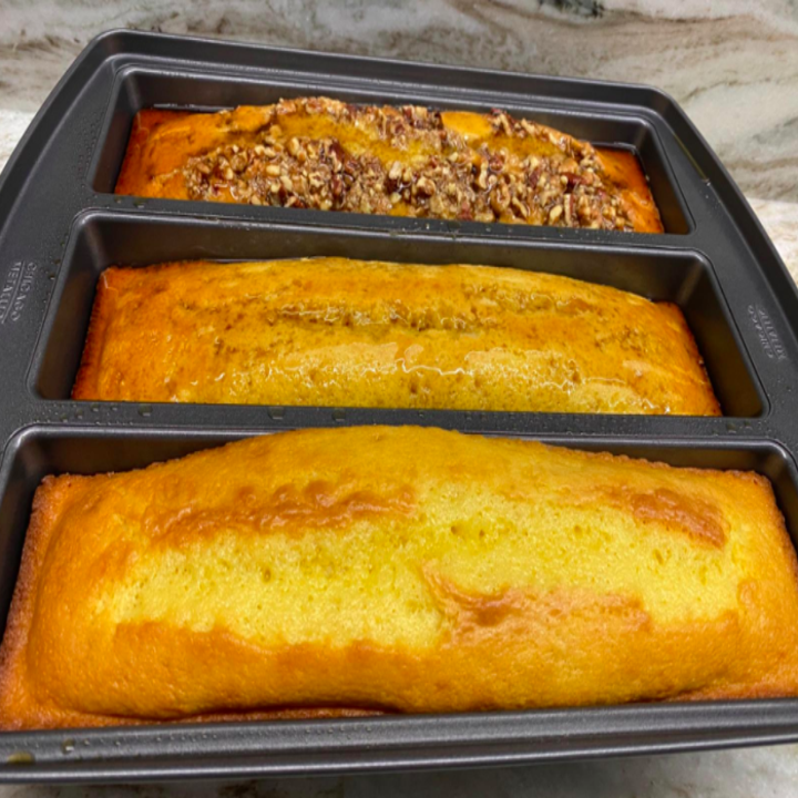 A reviewer photo of three different types of bread made in the pan