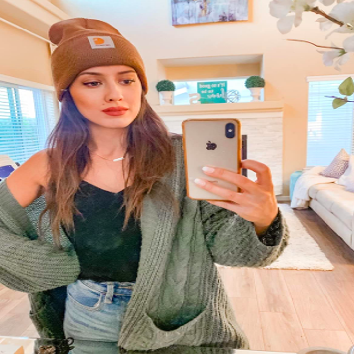 Different reviewer wearing cat in brown 