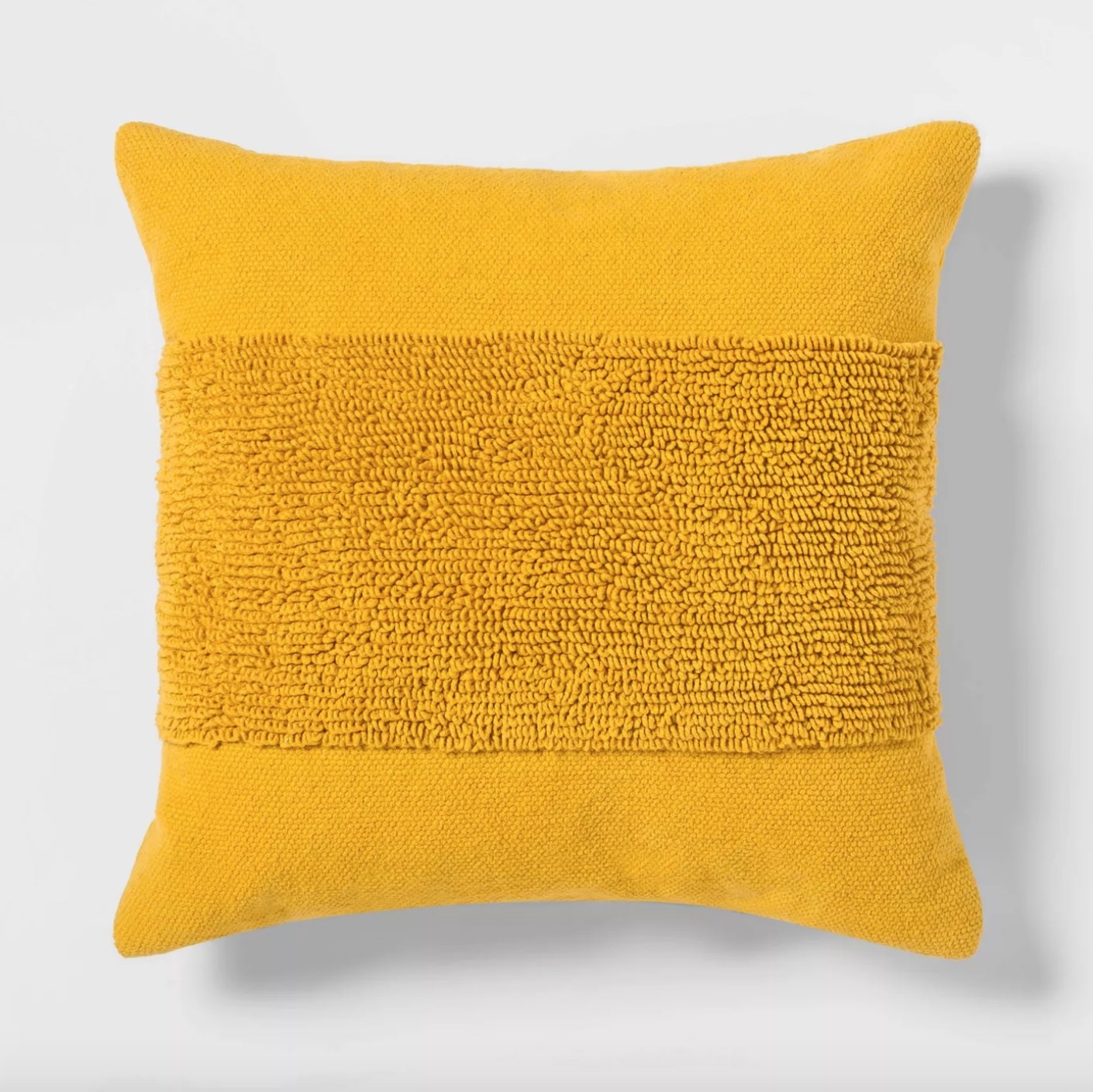 The tufted square throw pillow in yellow