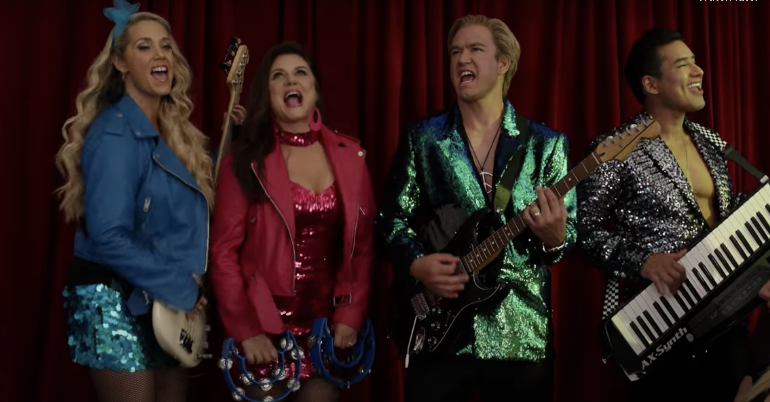 Characters A.C. Slater, Jessie Spano, Kelly Kapowski, and Zack Morris performing in a band