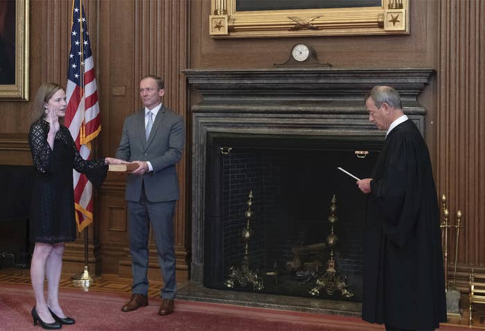 Amy Coney Barrett is sworn in by Chief Justice John Roberts