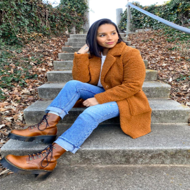 Reviewer wearing jacket in tan