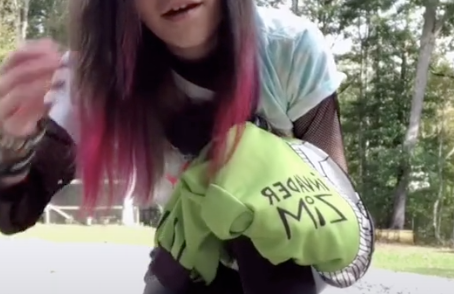 Bailey holds an Invader Zim sweatshirt in her hand