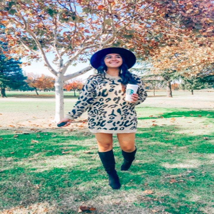 Different review in traditional leopard print wearing as a mini dress with knee-high boots