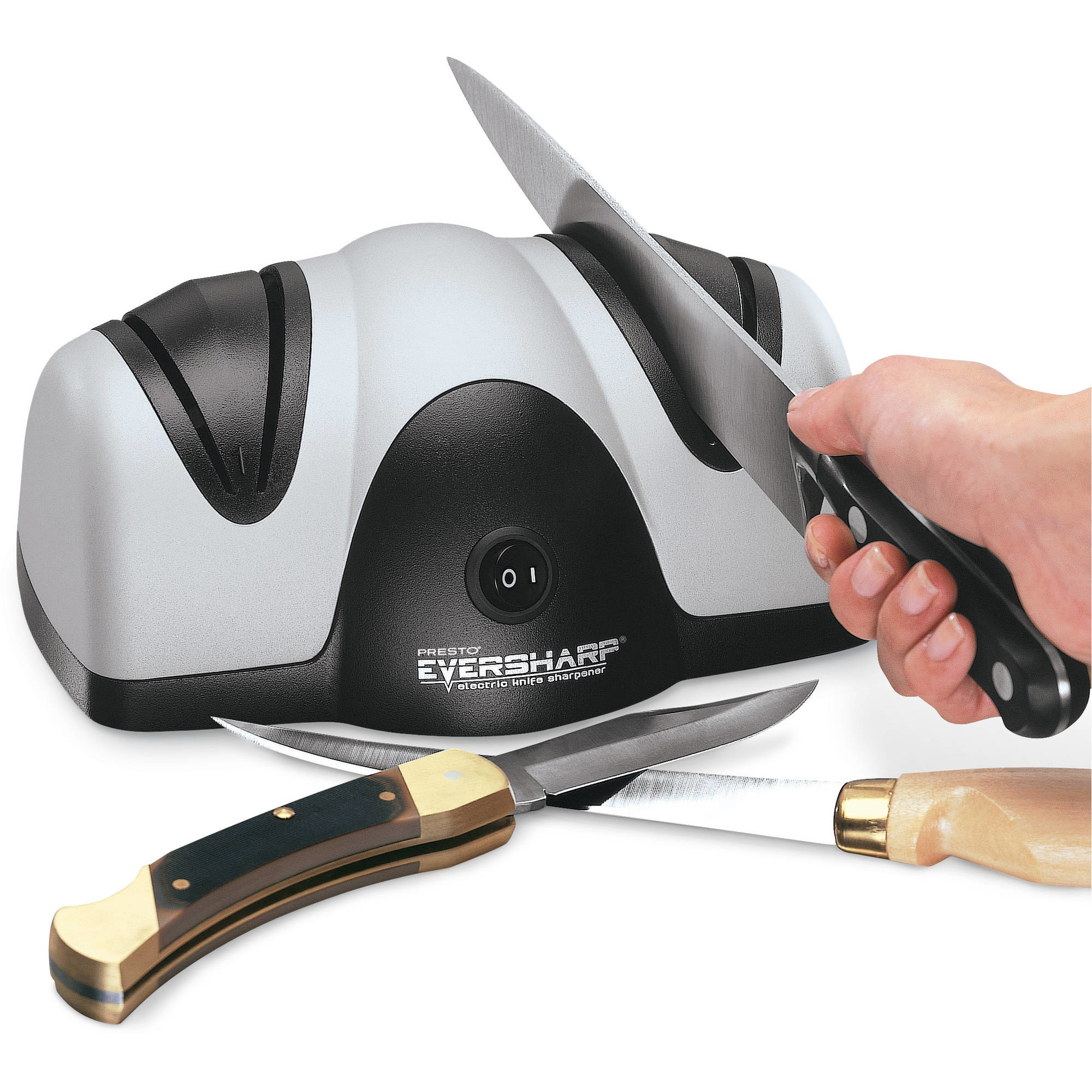 person using an electric knife sharpener to sharpen a chef&#x27;s knife
