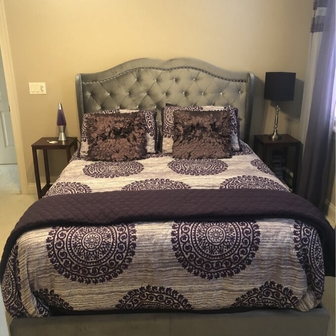 A reviewer photo of the bed in gray
