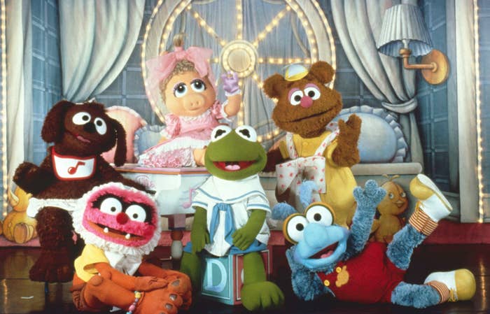 Promotional photo of performers dressed as Rowlf, Animal, Piggy, Kermit, Fozzie, and Gonzo from Muppet Babies