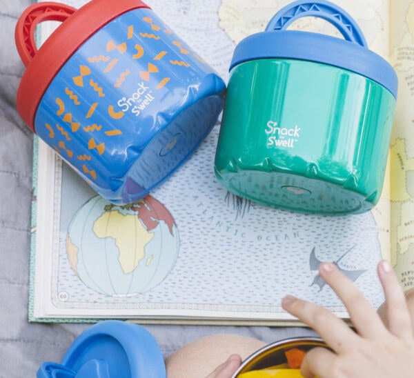 Two s'nack containers on top of a map