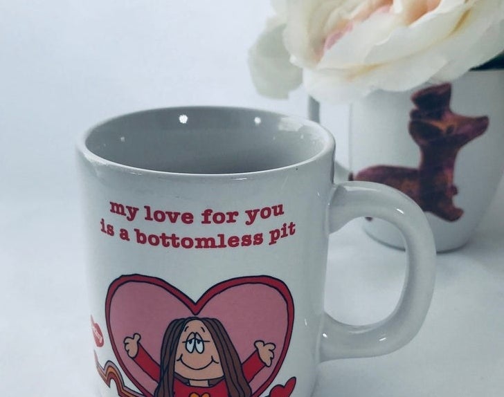 A mug with Cathy in a heart reaching out for a hug with &quot;My love for you is a bottomless pit&quot; written over her