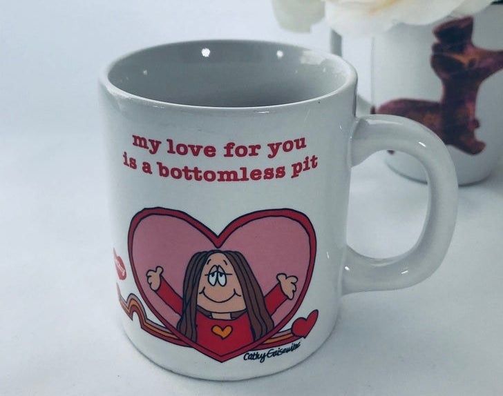 A mug with Cathy in a heart reaching out for a hug with &quot;My love for you is a bottomless pit&quot; written over her