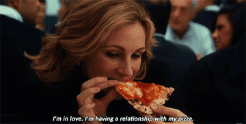 Julia Roberts from &quot;Eat, Pray, Love&quot; eating a slice of pizza.
