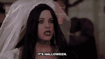 Girl in Halloween costume saying, &quot;It&#x27;s Halloween&quot;