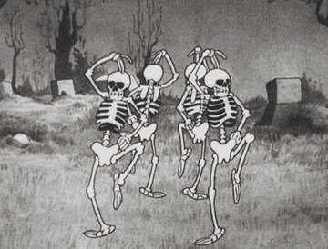 Cartoon skeletons dancing in a circle.