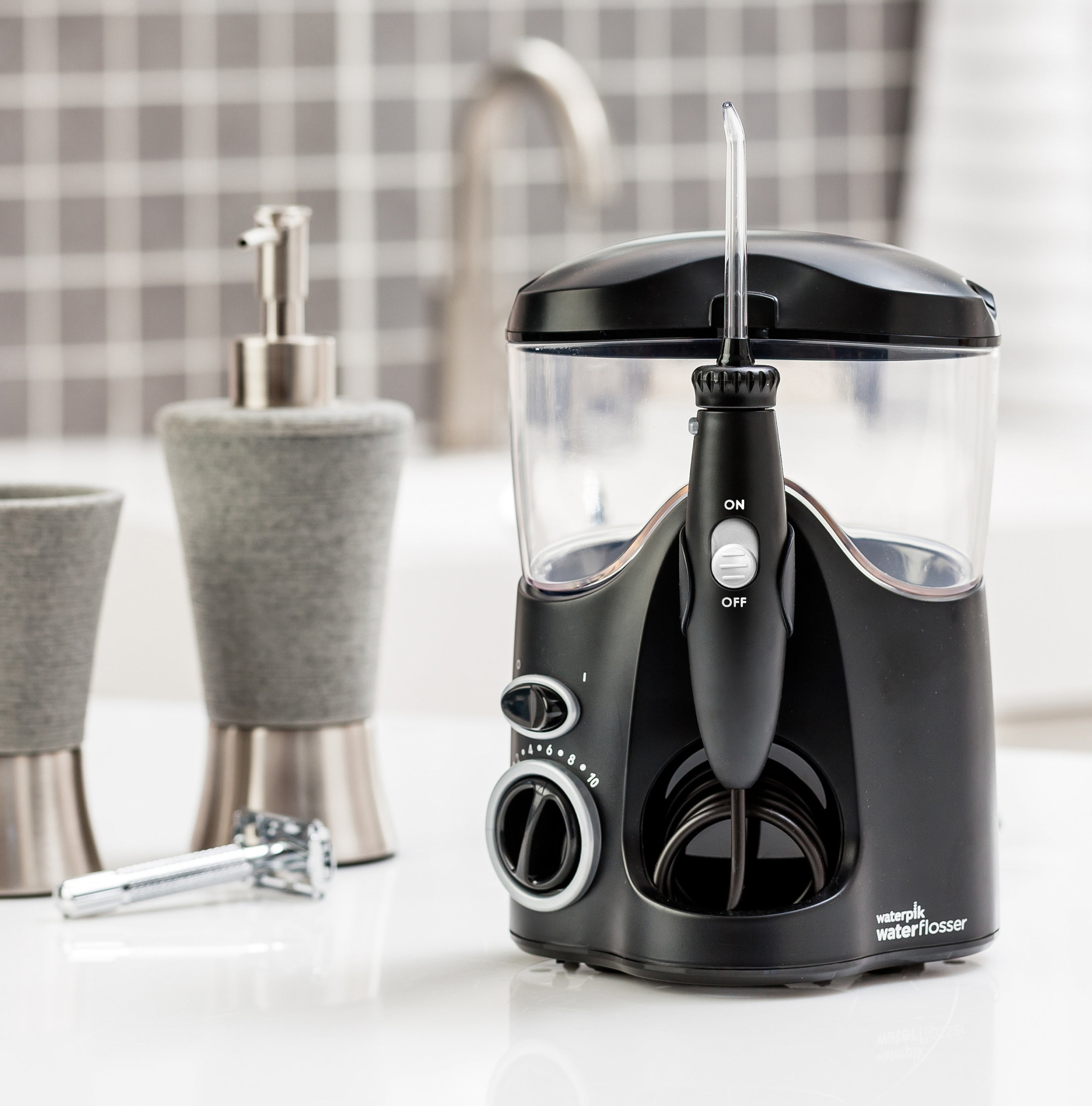 black water flosser sitting on top of a bathroom counter