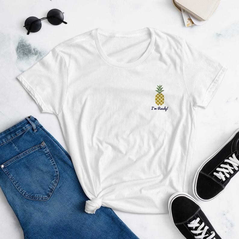 The spongebob i'm ready shirt displayed next to a pair of jeans and sneakers