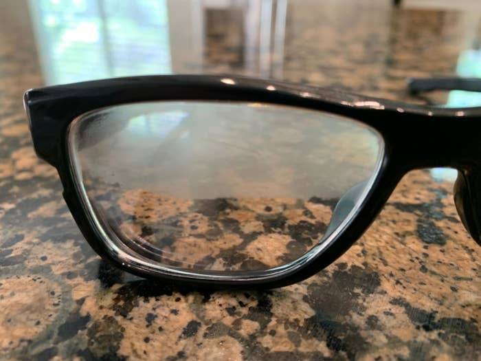 A glasses lens with fog on the top half and no fog on the bottom half