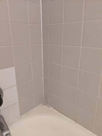 The same bathtub with mold and mildew removed