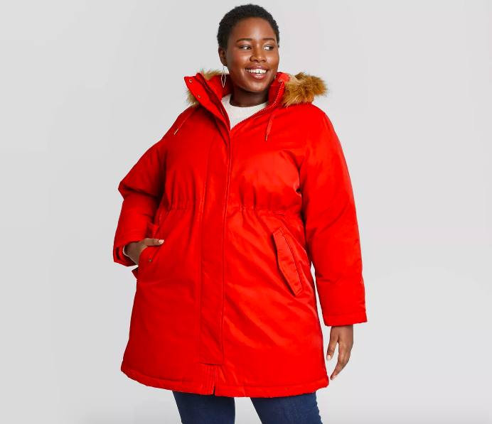 Model wearing parka in a bright red