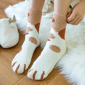 Top of socks with spots and paws 