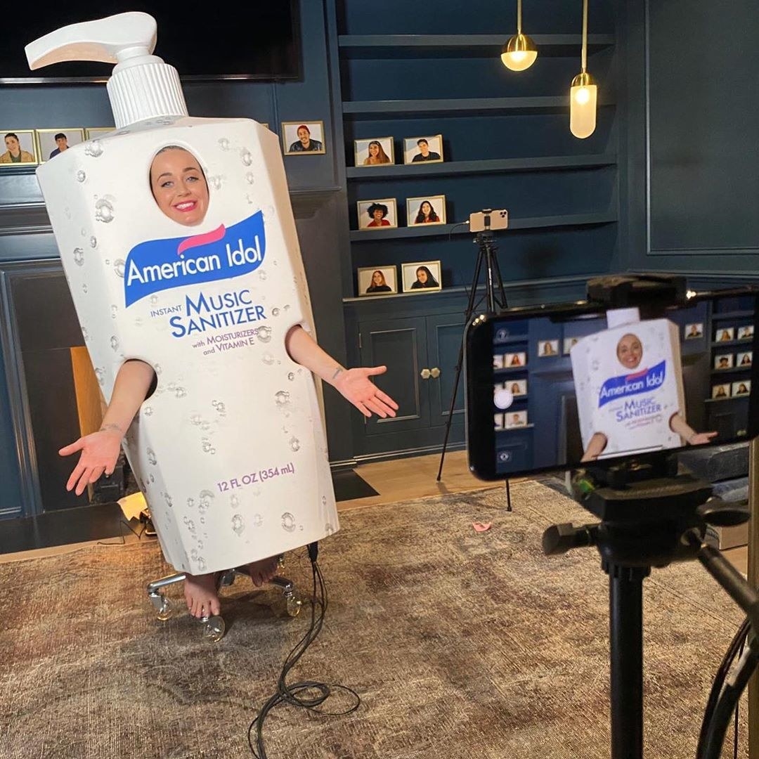 Katy Perry in her costume with words, American Idol Instant Music Sanitizer being filmed on a phone