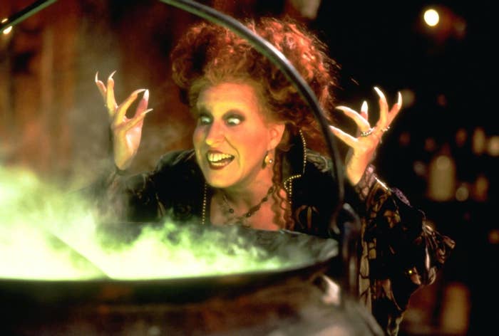 Bette Midler as Winnifred standing in front of her cauldron in Hocus Pocus
