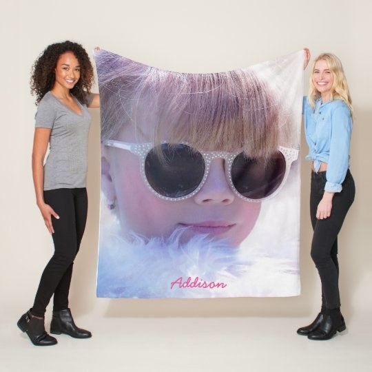 Two Models holding up blanket with custom photo and text