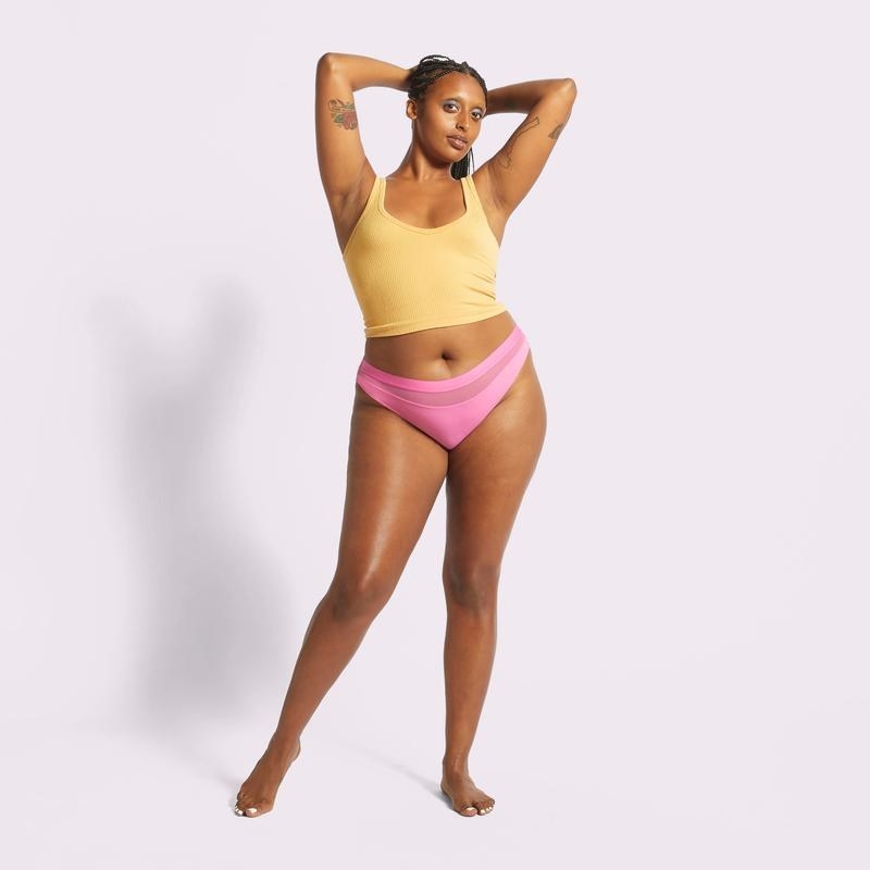A Black plus size model wears the parade brief in dreamhouse