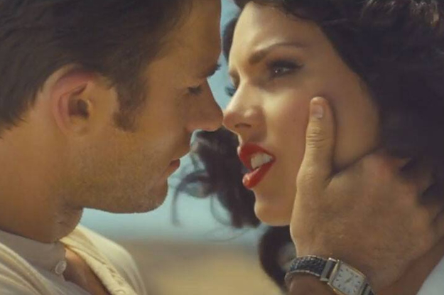A brunette taylor swift and a handsome man about to kiss