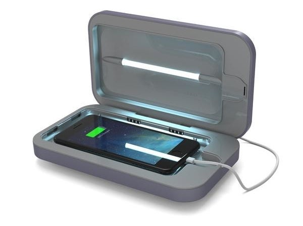 A phone inside of the smartphone sanitizer in periwinkle