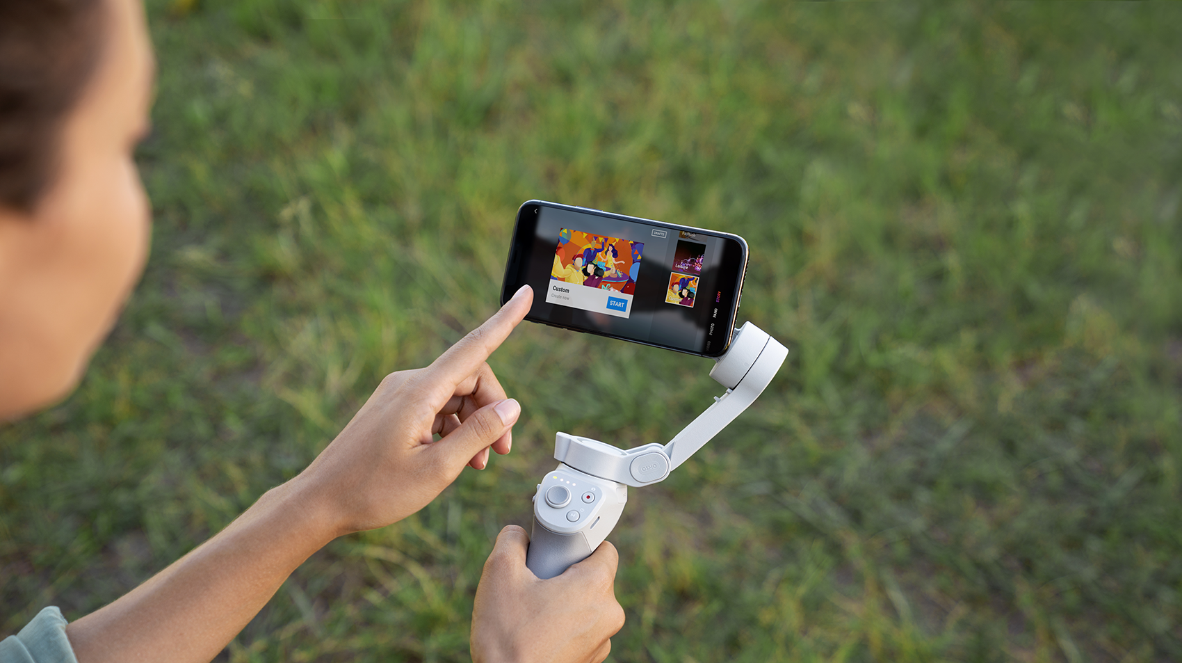 A woman using the DJI Mimo app with her finger